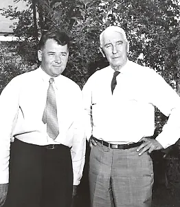 Couple of men posing for a photo
Description is automatically generated